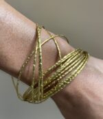 Pulsera rígida - Hilos dorados entrelazados