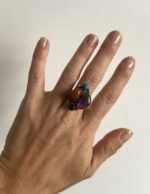 anillo ajustable con cuatro piedras multicolor sobre base en baño de plata
